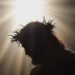 Silhouette of Jesus Christ with crown of thorns and radiant light symbolizing His sacrifice and resurrection, representing the true meaning of Easter in 2025