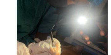 Nigerian Doctor Sparks Reactions After Performing Surgery in Near Darkness